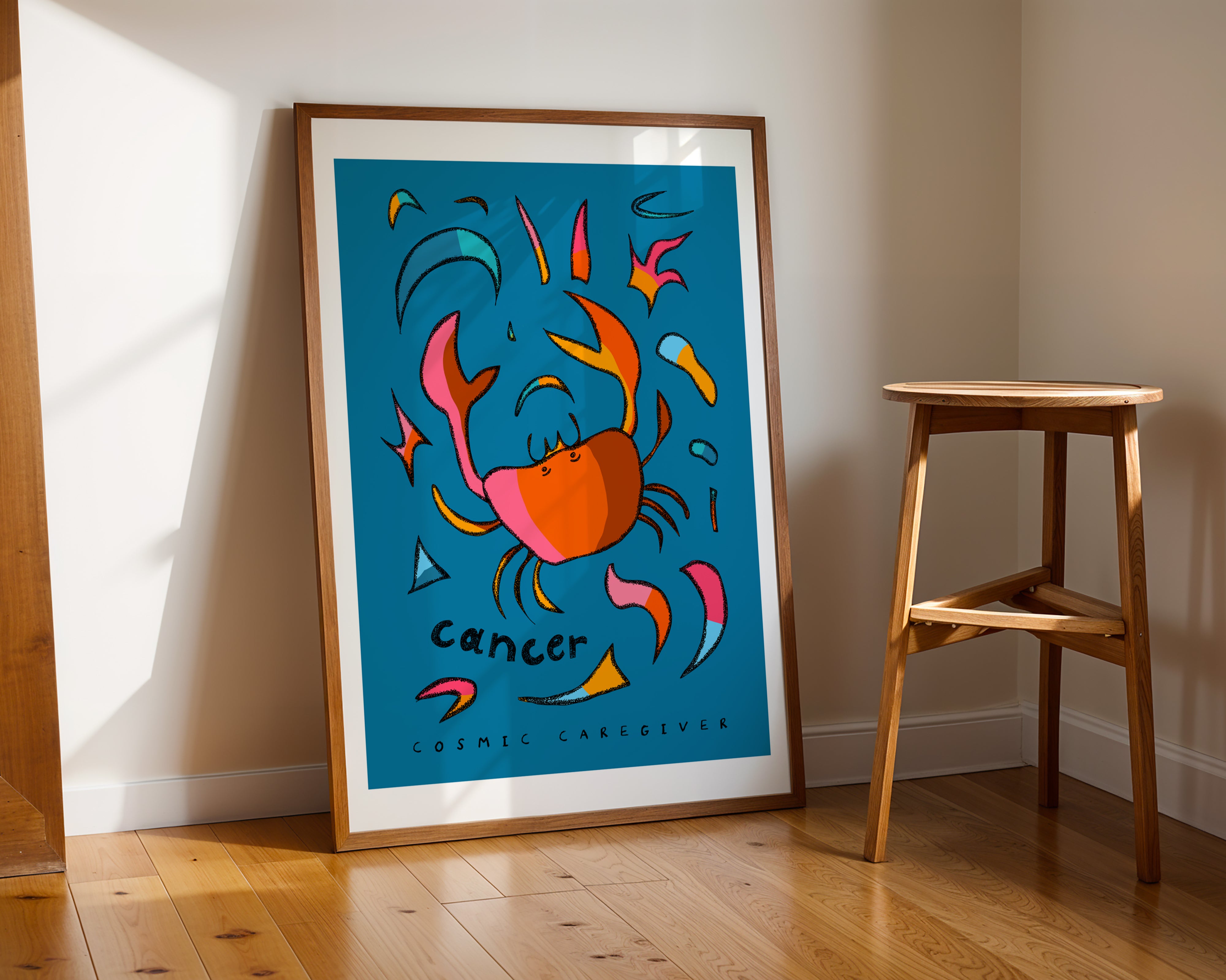 Cancer zodiac art print of crab with the cancer trait cosmic caregiver written under the hand-drawn crab.