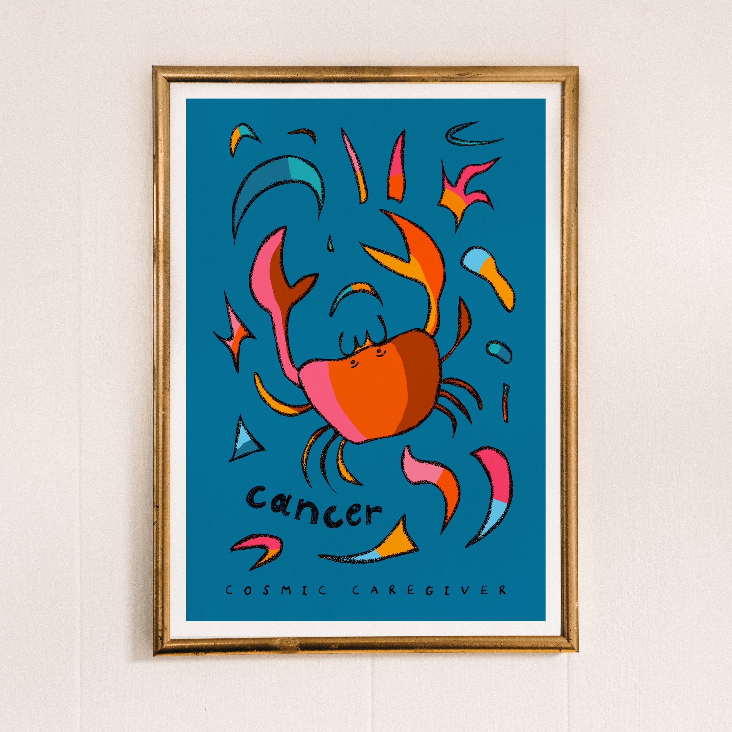 Cancer zodiac art print of crab with the cancer trait cosmic caregiver written under the hand-drawn crab.
