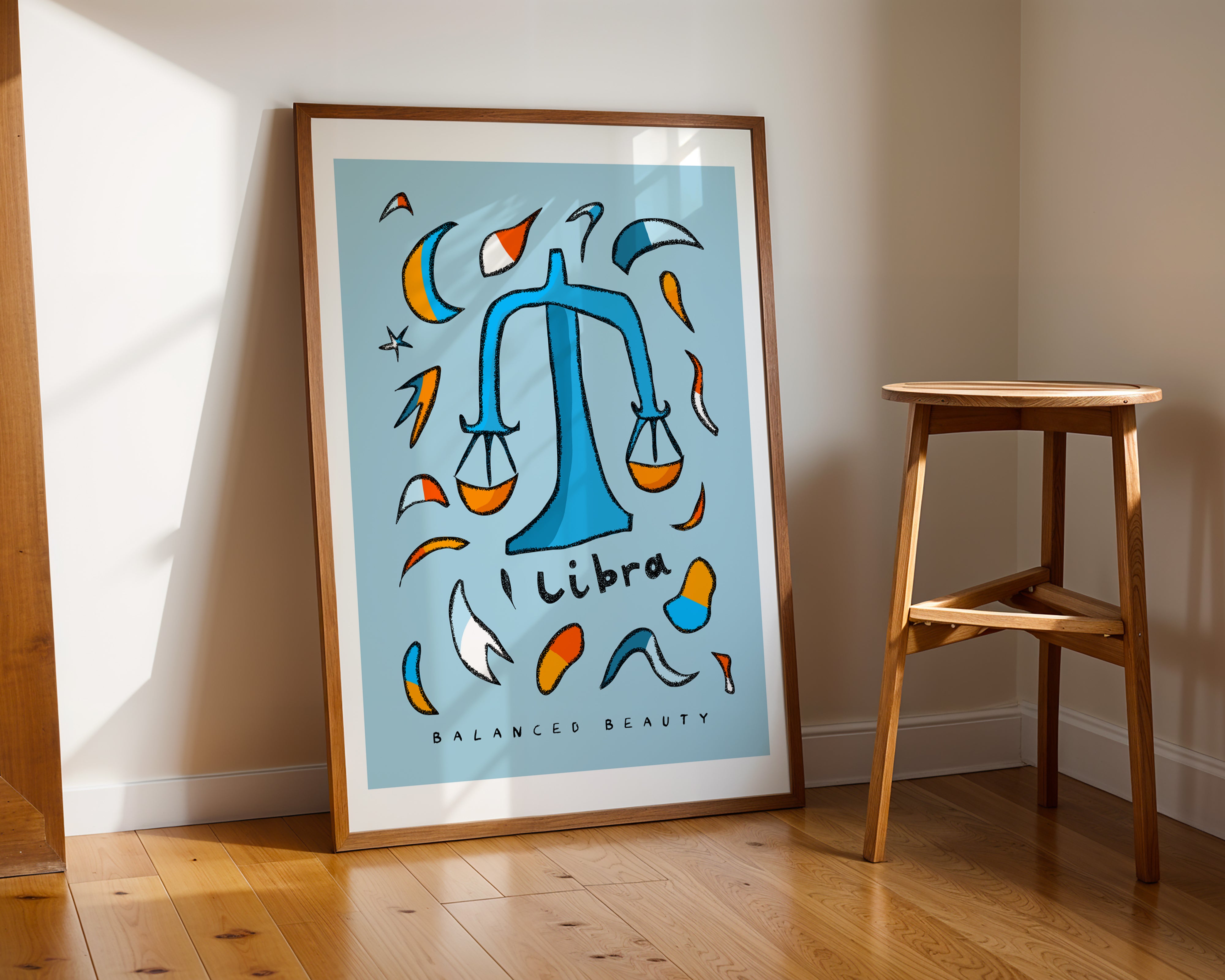 Libra zodiac art print with the libra trait balanced beauty written underneath the hand-drawn illustration on a blue background.