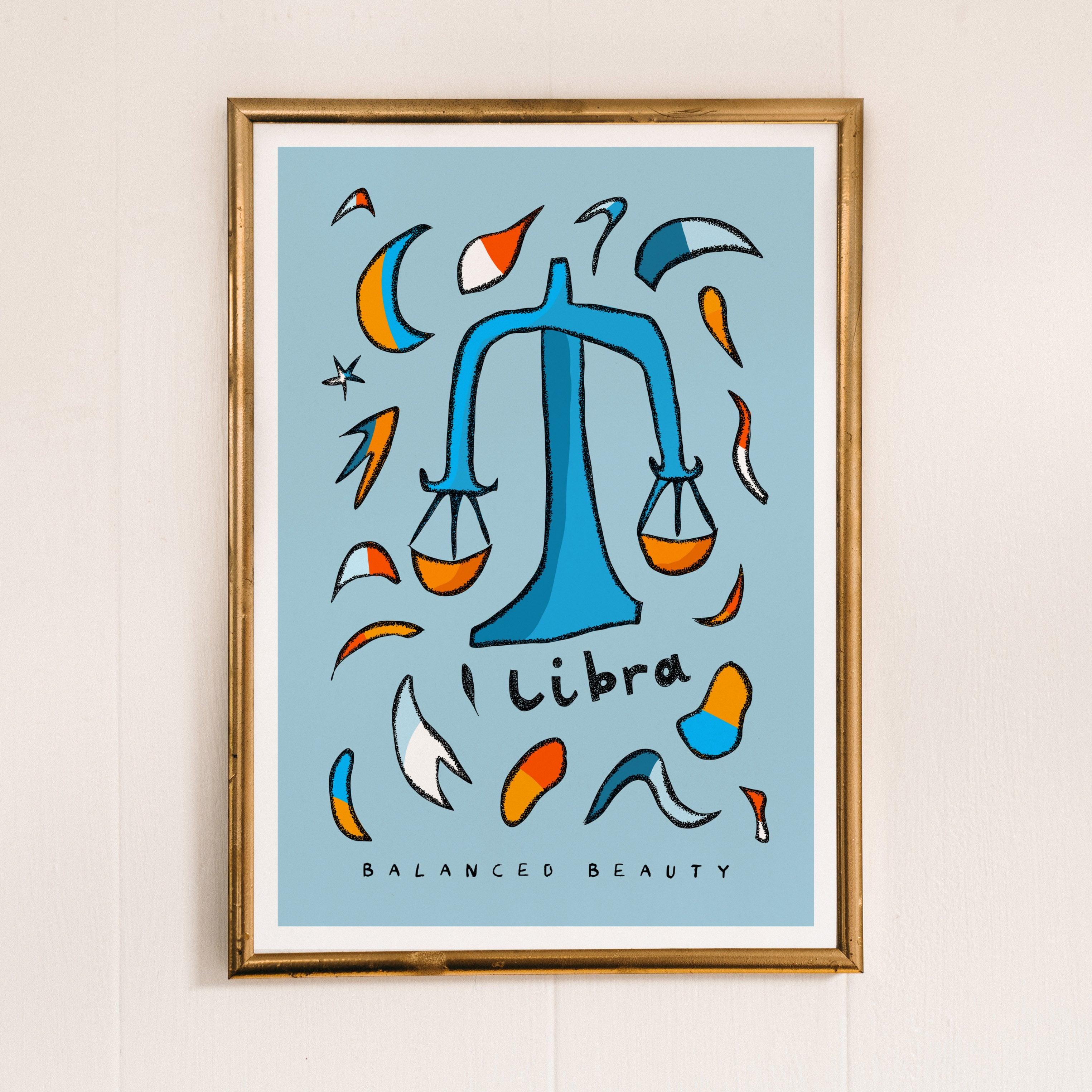 Libra zodiac art print with the libra trait balanced beauty written underneath the hand-drawn illustration on a blue background.