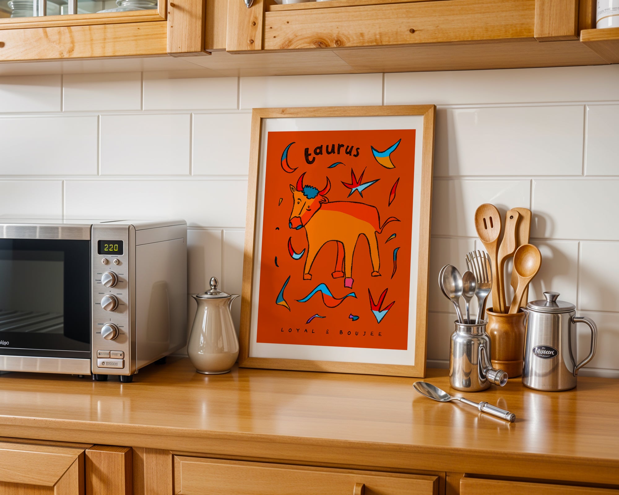 Taurus zodiac art print of a hand-drawn bull with the taurus trait loyal and boujee written underneath on an orange background.